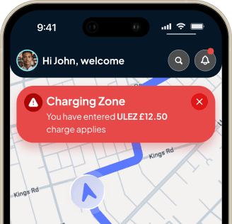 Tracklio on iPhone showing a live charging zone alert over a route map